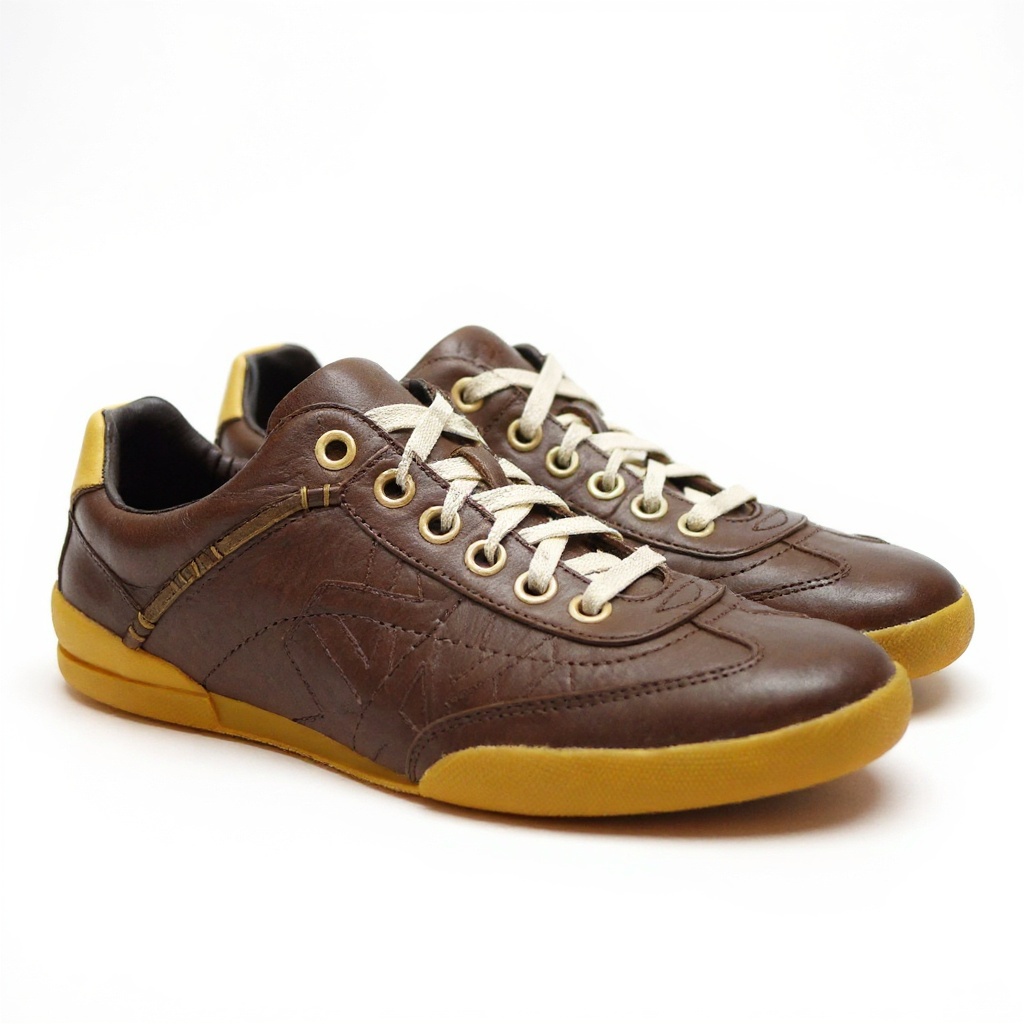 Vista detallada de las zapatillas deportivas TIMBERLAND marrones, mostrando la textura de la piel engrasada, los materiales textiles y el diseño de la suela.